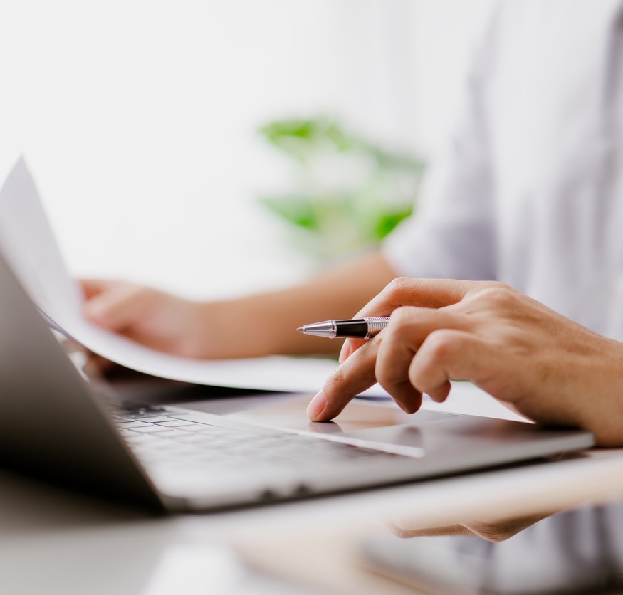 person taking notes on how to manage an online community